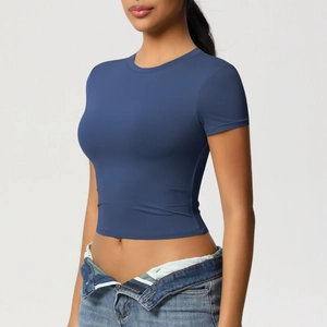 Slim fit dark blue yoga crop top with crew neck paired with vintage denim jeans