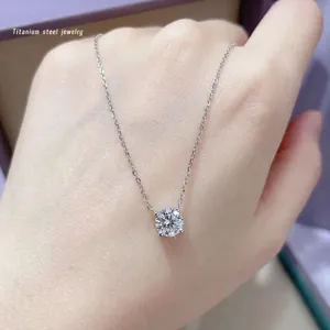 Titanium steel necklace featuring a single round zircon pendant in classic 4-prong setting