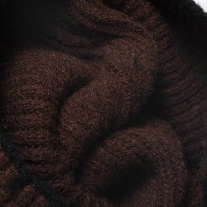 Thick dark brown ribbed knit winter hat featuring warm wool blend and soft chunky texture