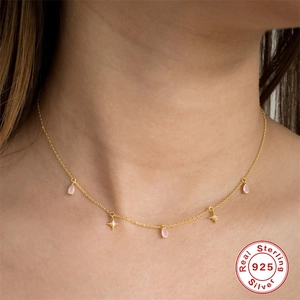 925 Sterling Silver choker with pink waterdrop pendants and star charms on model