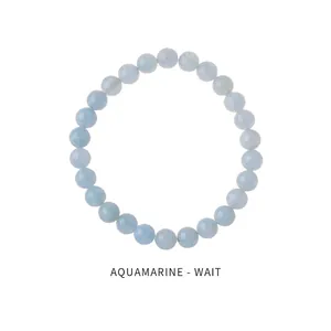 Macro detail of natural light blue aquamarine beaded bracelet with round translucent stones