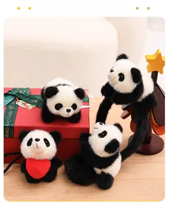 Close-up of four cute plush panda keychain styles with soft fur and pink blush details