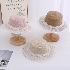 Kids straw hats with lace trim and sequins in pink, beige and tan colors for summer beach sun protection