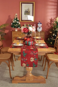 Detailed Christmas table runner and placemats with festive bells and berry prints