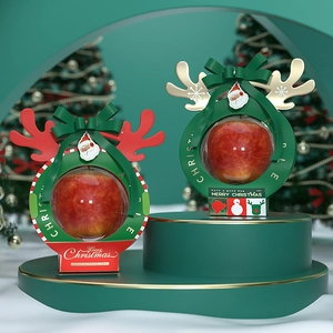 Christmas apple gift box with red ball design and festive reindeer decorations