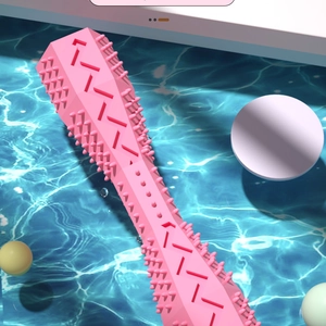 Detail of pink hex pet chew toy with textured spikes for dog dental cleaning