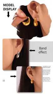 Model wearing minimalist hollow C-shaped crescent earrings in gold and silver finish