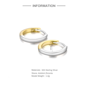 Detail of 925 sterling silver two-tone U-shape earrings with zircon and 9mm inner diameter
