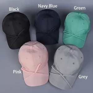 Satin bow baseball caps in black, navy, green, pink, and grey on a grey background