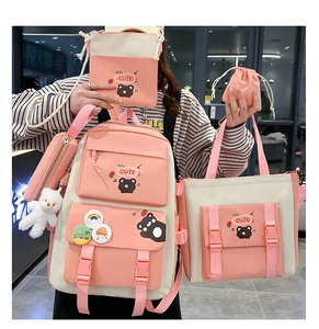 Detailed set of five nylon school bags featuring pink and white colors with cute bear motifs