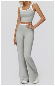 Detail of high-waist sage green yoga set with contrast white trim and high elasticity fabric