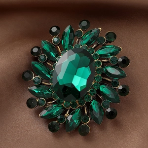 Vintage emerald flower brooch with rhinestones in an antique gold setting for women