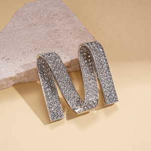 Luxury silver M-shaped brooch with shimmering crystals for elegant suit accessories