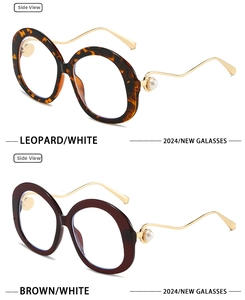Side view of oversized round fashion glasses with pearl accents and wavy metal temples