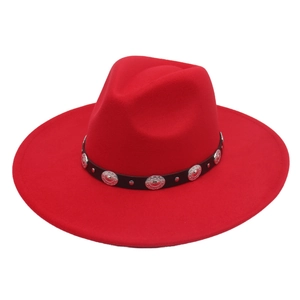 Detail of red wool felt fedora featuring black leather band and silver metal studs