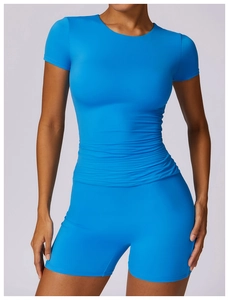 Detail of royal blue high-elastic sports set featuring ruched slim-fit tee and high-waist shorts