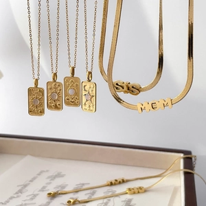 Golden tarot pendant necklaces featuring Sun, Moon, Star symbols and Mom Sis charms