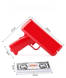 Detailed dimensions of red plastic money gun toy with prop bills on white background