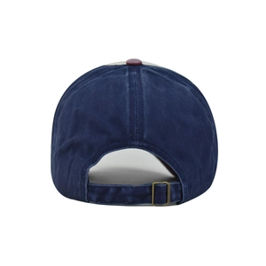 Detail of vintage metal buckle and adjustable strap on a washed denim baseball cap