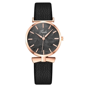 Fashion women's watch featuring a rose gold bow detail and black leaf pattern dial