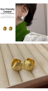 Detail of square earrings with textured copper surface in gold and silver finish