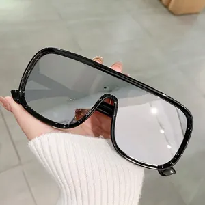 Modern oversized aviator sunglasses with black frames and silver mirrored lenses