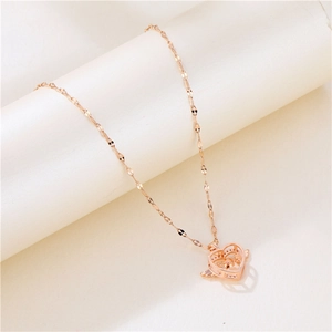 Rose gold angel wing heart necklace with moving stone pendant on minimalist stand