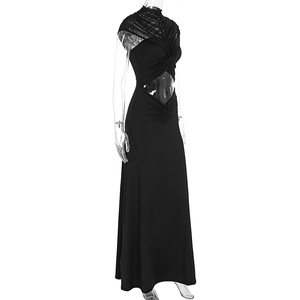 Detail of waist diamond cut-out and ruching on a black high-neck mesh midi dress