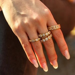 Gold heart-shaped zircon ring set in stainless steel for a luxury fashion stacking look