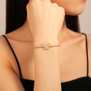 Elegant gold butterfly bracelet with zircon butterfly pendant on a sparkling tennis chain