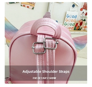 Detail of adjustable pink leather shoulder straps with silver buckles on kid's backpack