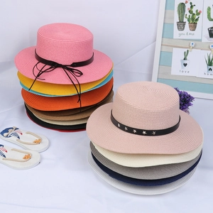 Selection of wide brim straw sun hats in various colors with ribbon and belt details