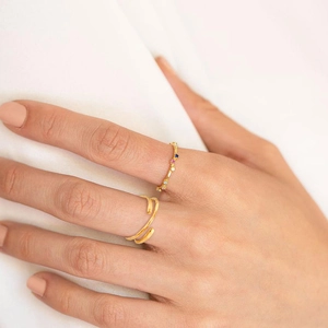 Stacked 18k gold plated open rings with colorful zircon stones on woman hand