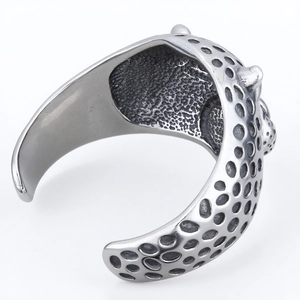 Rugged stainless steel leopard bangle with hammered honeycomb texture and open design
