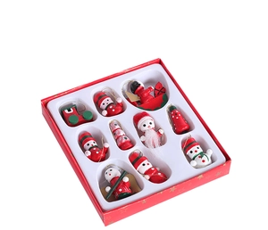 Close-up of 10-piece wooden Christmas ornaments set including Santa and snowman in red gift box
