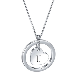 Detailed view of silver hollow circle and heart pendant necklace with engraved letter U