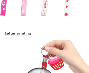 Detail of colorful silicone lanyards with cupcakes and heart letters for gift favors