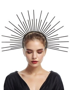 Detailed view of a black sunburst headband worn by a model for a gothic sun goddess look