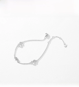 Detailed close-up of S925 sterling silver infinity bracelet with pavé cubic zirconia accents
