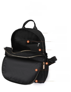Detail view of large capacity black nylon backpack with six functional storage compartments