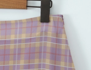 Detailed view of the purple and yellow plaid skirt showing the side invisible zipper closure