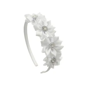 Detail of white satin floral headband with sparkling rhinestone centers for girls