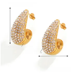 Detail view of gold titanium steel teardrop earrings with Czech diamond inlays