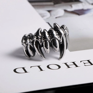 Macro shot of punk style claw ring in vintage oxidized titanium steel finish