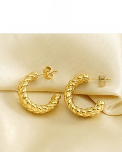 Detail of 18K gold plated hoop earrings with wheat twist texture on silk fabric