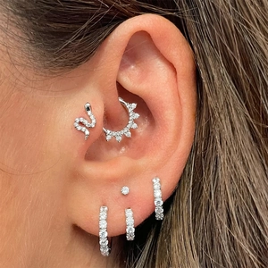 Macro shot of S925 sterling silver earring set with snake stud and cubic zirconia hoops