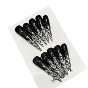 Handmade punk long stiletto press-on nails in black glaze with 3D silver metal flame design