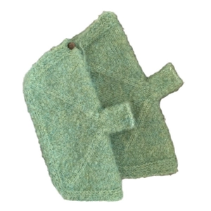 Women's green knit fingerless gloves with decorative brown button in a minimalist style