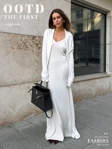 Detail of soft knit texture on white long-sleeve cardigan and V-neck slip dress set