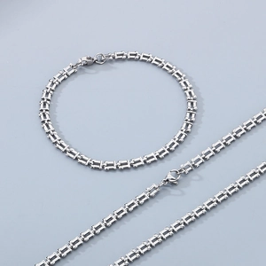 Detail of silver titanium watch-band style chain necklace and bracelet jewelry set